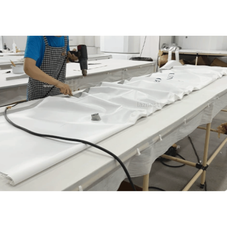 a worker is making inflatable swimming pool in factory