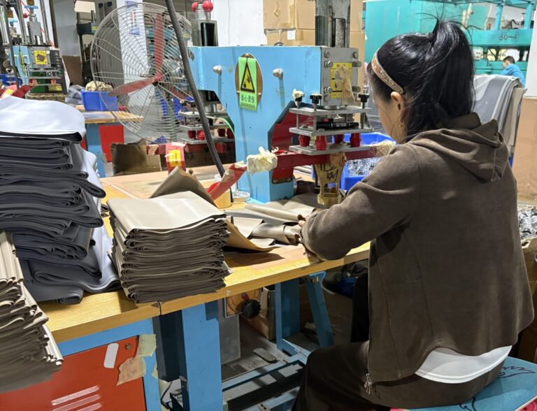 a worker is working in an air mattress manufacturer